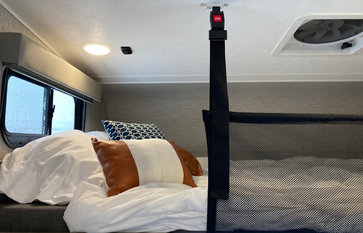 Queen size bed over the cab.