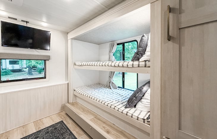 Bunk beds with Roku TV in bunk room.