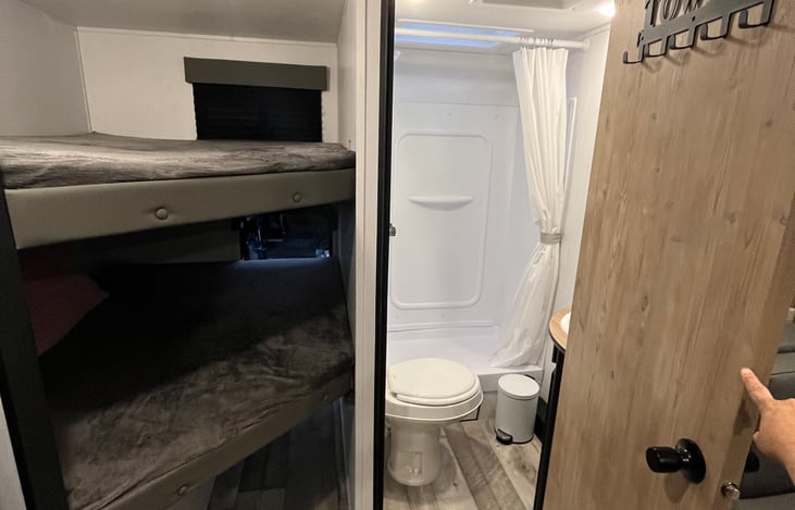 Bathroom and Bunk beds; we are currently replacing the bottom bunk mattress, so the bottom bunk is half this size, pictures will be updated soon! Stay tuned!
