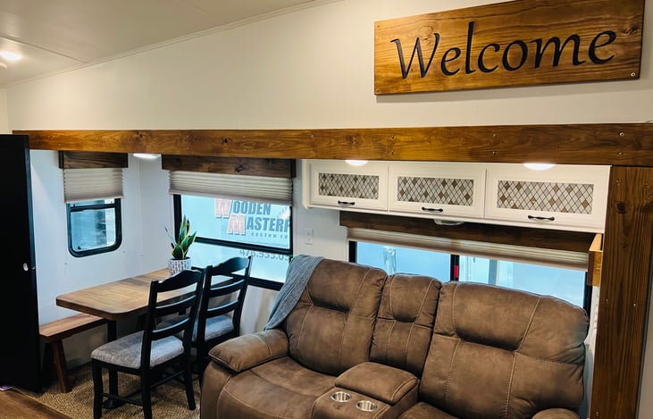 Living, dining kitchen area. Loveseat recliner