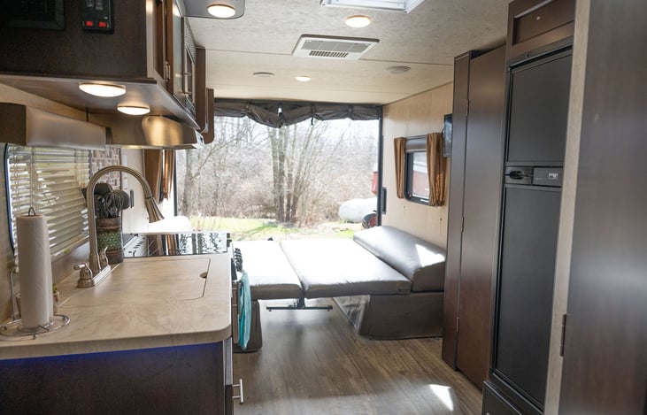View to the left as you walk into camper.  The bay door is open and made into a porch/deck