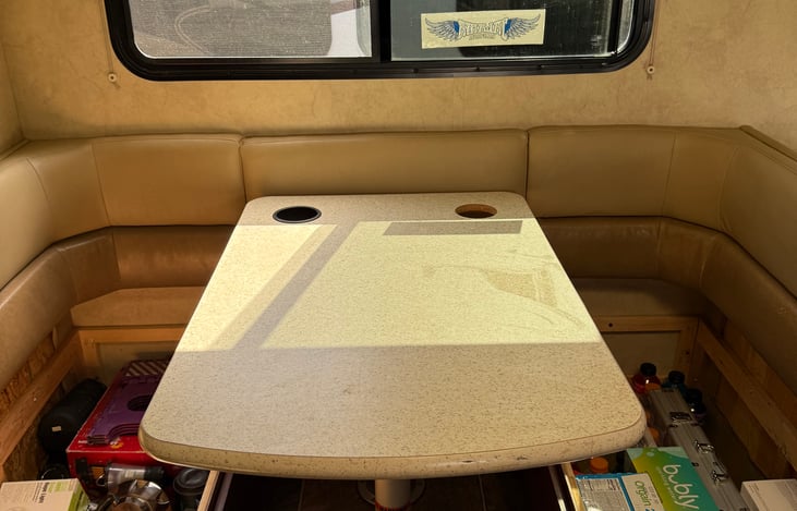 Dining area with dual couch seating can be made into the fourth bed as an option