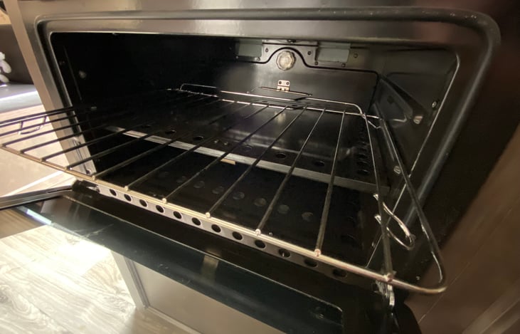 Kitchen: open oven with pulled out rack