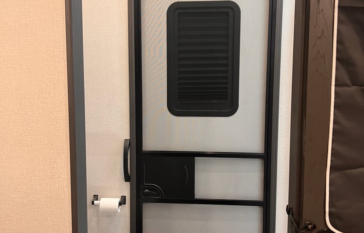 Guest bedroom into guest bathroom and rear entry door.