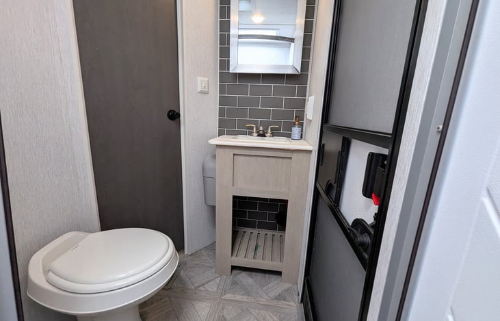 Nice bathroom with its own entry door for convenience.