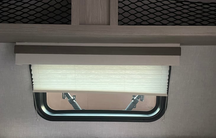 Large storage area, and pull down window panel new.