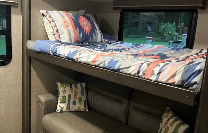 This twin-size bed can lift up for more head room on the couch