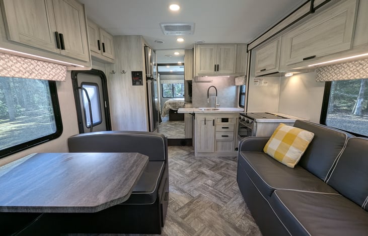 Spacious, bright & modern interior. Well-stocked kitchen with stove-top and convection microwave. Comfy couch and dinette both convert to beds. Large overhead bunk with swing-out TV for entertainment.
