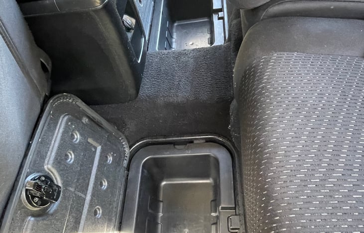 Roomy, removable storage compartments on the floor of the second row seats provide extra room for food storage or even ice chests.