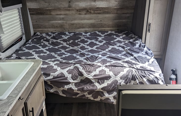 Queen size Murphy bed down with Sofa underneath.