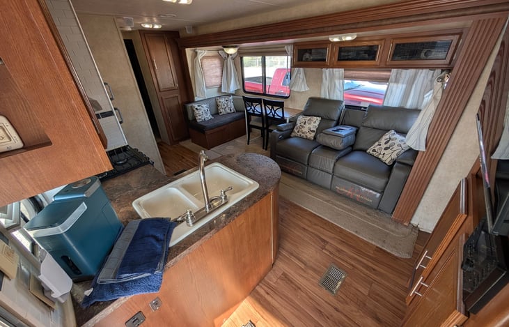 Kitchen outfitted with all your cooking essentials and dinnerware and keurig coffee machine. Nice seating area and room to relax and lounge.