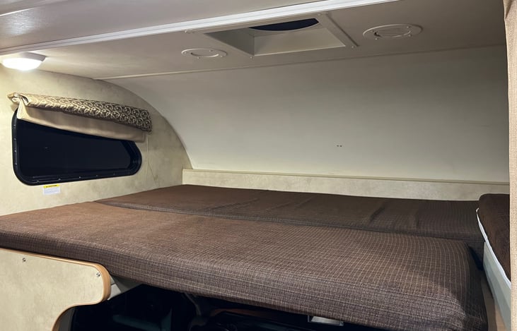 Upper bed area above driver