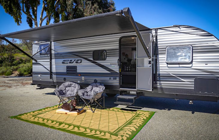 (2) large outdoor mats and (2) oversized comfy camping chairs included with every rental.  Dog bed will be included with optional pet package.