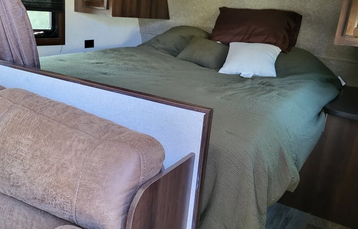 Queen bed with curtain for additonal privacy.