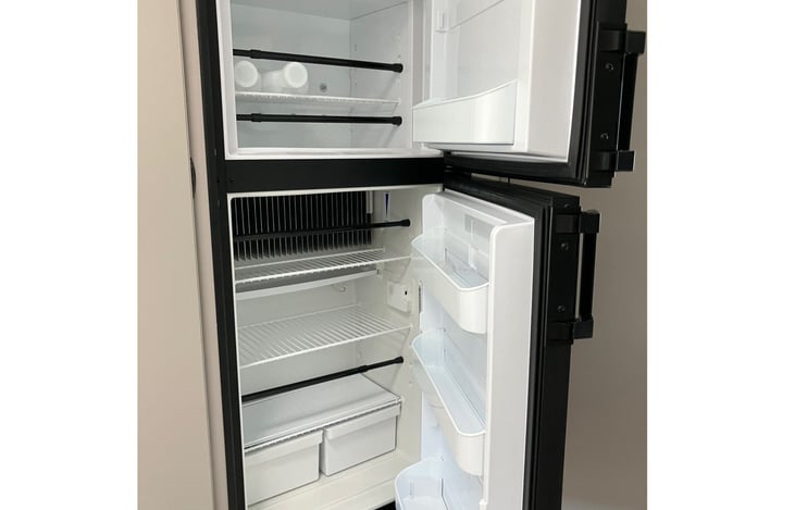 This is a full size refrigerator and freezer so no worries about keeping your drinks and produce fresh and cold. The pantry for dry goods is to the left with room for 1 month of provisions.