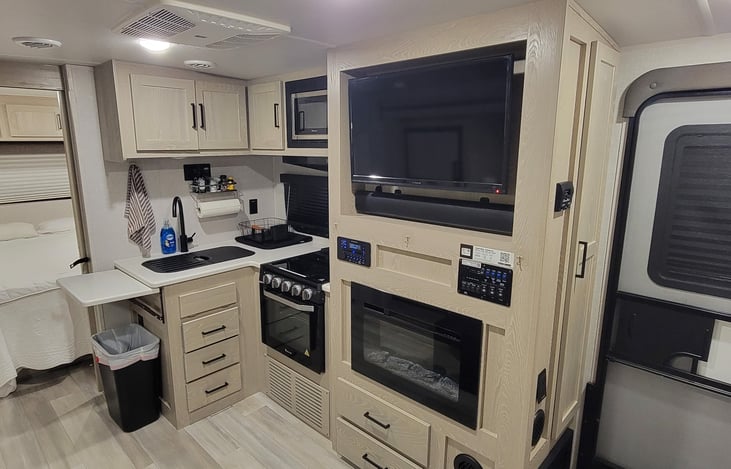 Electric fireplace that will heat the entire camper on those brisk mornings! The unit is four season rated with heated tanks and 1200 BTU furnace.