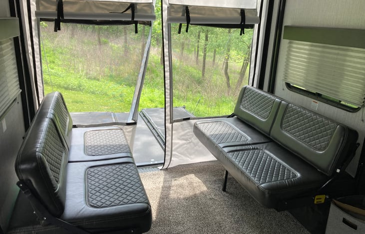 Dinette in the garage space folds down into a queen bed