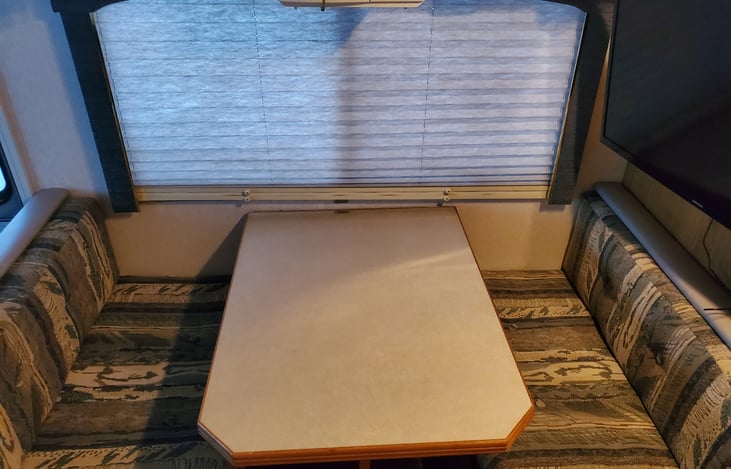 Dining room table folds into bed