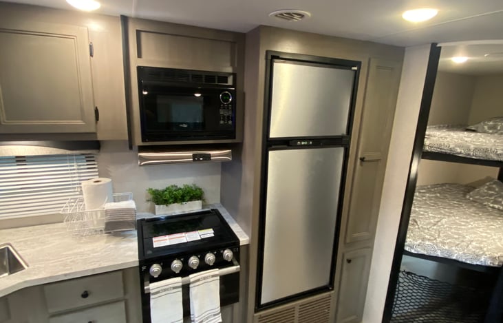 Close up view of fridge and bunks