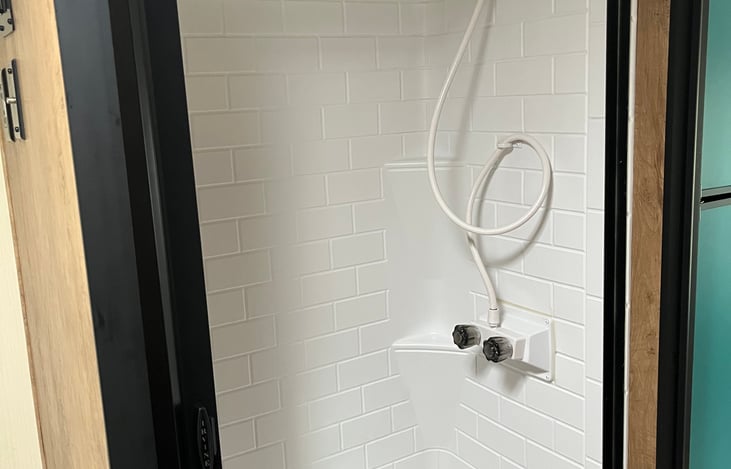 Dry Bath (2) is across the hallway from Dry Bath (1) and features shower nozzle which you can choose to use as free sanding or hand held. Also has privacy "wall" to separate yourself privately.