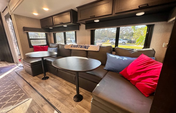 Living/dining area. Tables remove for couch to fold out into a double bed.