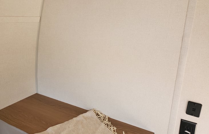 Nightstand area at food of bed