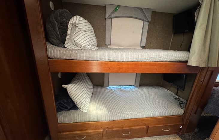 Twin Bunkbeds with 3 drawers underneath.