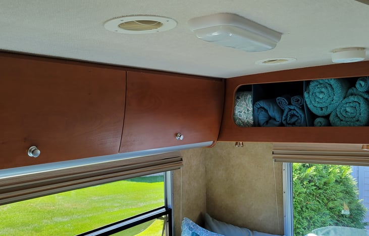 Lots of Honey Cherry storage cabinets in the bedroom