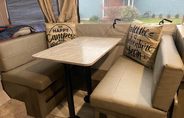 Cute and cozy dinette set that easily converts to a bed, with storage underneath!