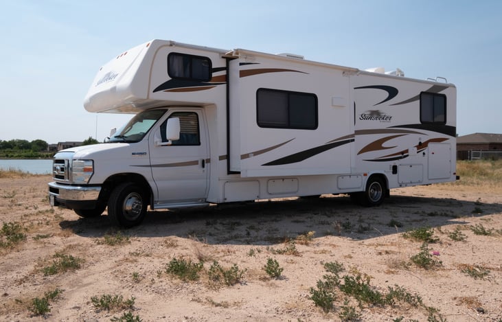 Class C RV. 32ft Long. 2 Slideouts. Sleeps 11. Triton 6.8L V10. 2 Queen Beds. 3 Full Beds. 1 Twin Bed. 44 Fresh Water Tank. 39 Gallon Gray/Black Tank (Each). 12.2 LB Onboard LP Tank.