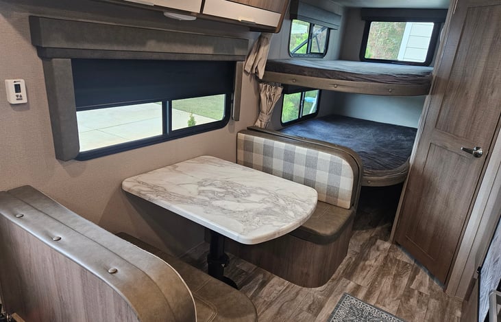 Dinette and Bunk beds with plenty of underneath storage