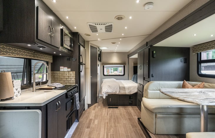 Queen bed in rear of the RV.