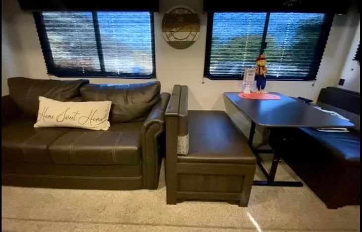 Couch, very comfortable, and folds out into bed.  Table that also turns into bed, if you want.