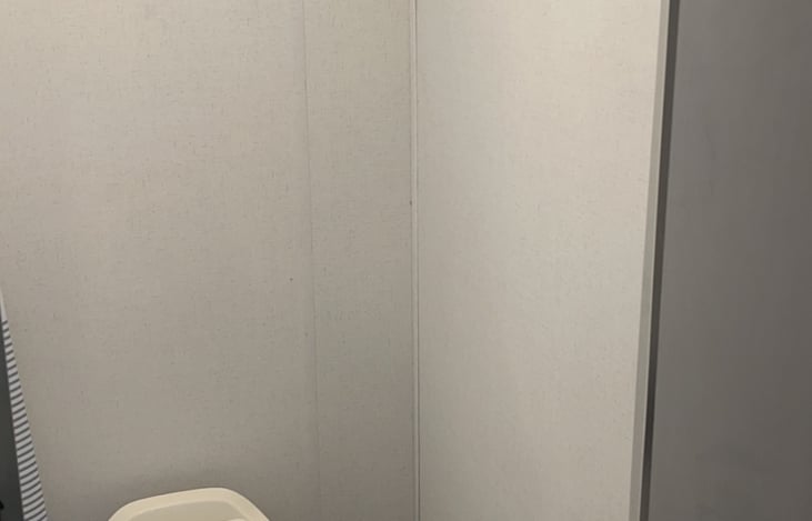 Flushable toilet and shower with exhaust fan