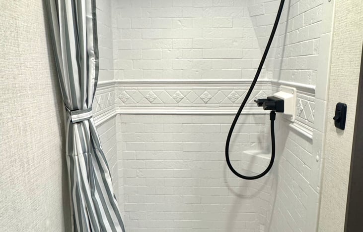 There is a skylight in the shower