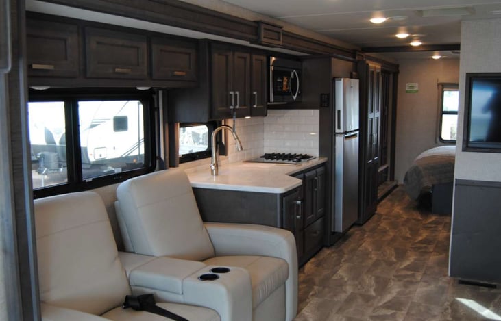 Kitchen with Convection Microwave and both gas and induction burners.