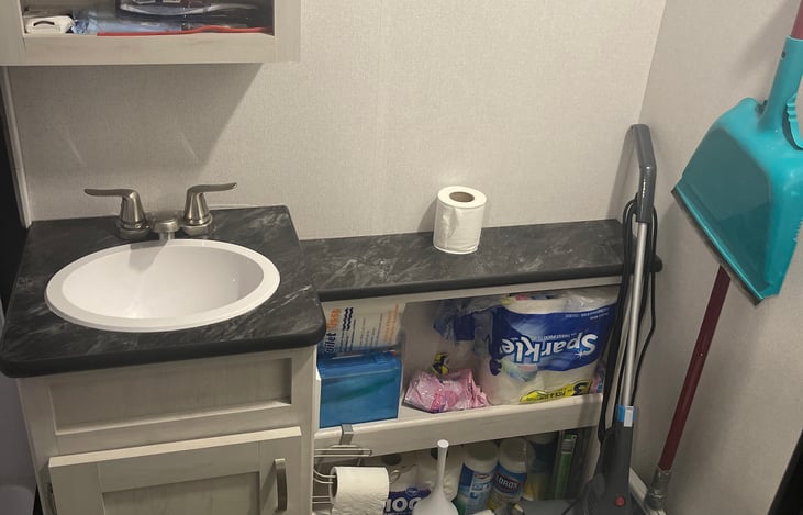 Shower area to the left is fairly roomy, even if your 6’5” tall you can stand up in this shower!