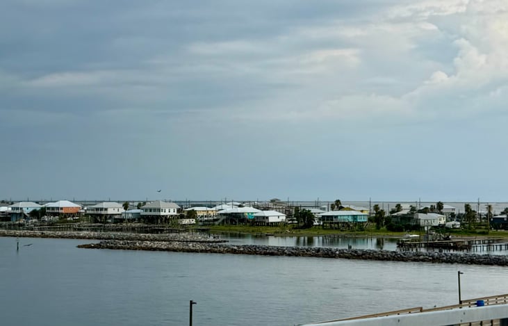 The RV is located in this area behind the first rue of houses.