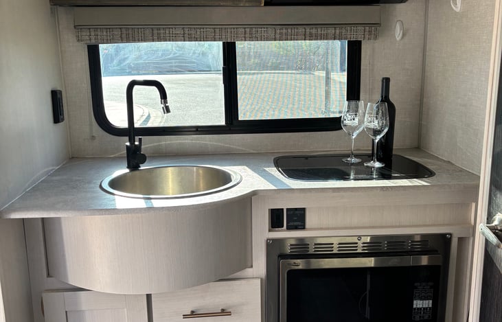 Fully stocked kitchen w/ sink, stove and convection oven/microwave