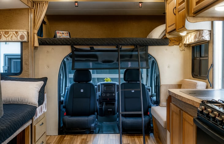 Front cab with overhead bunk with removable ladder.