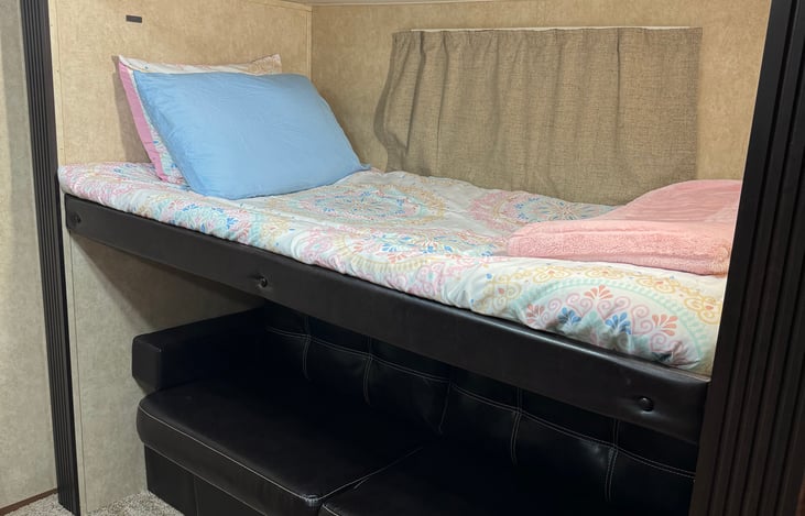 Back Room bunk and couch. Bunk will raise up for more seating area on couch