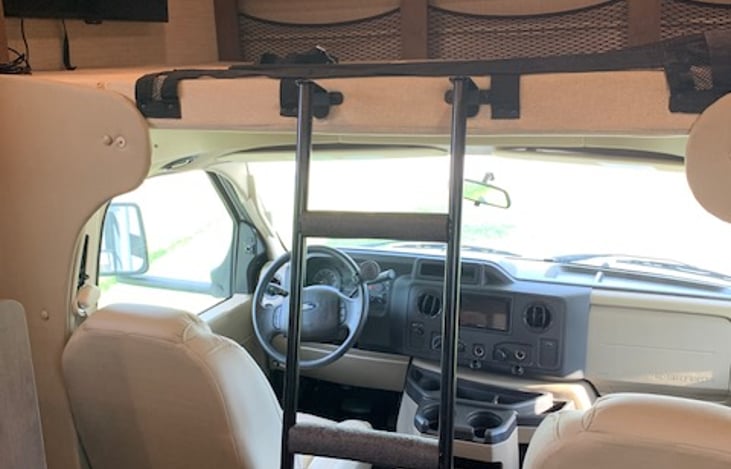 Overhead bunk with ladder.