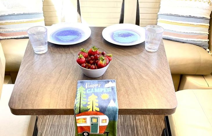 Rear table seating with the sofa and side bench.