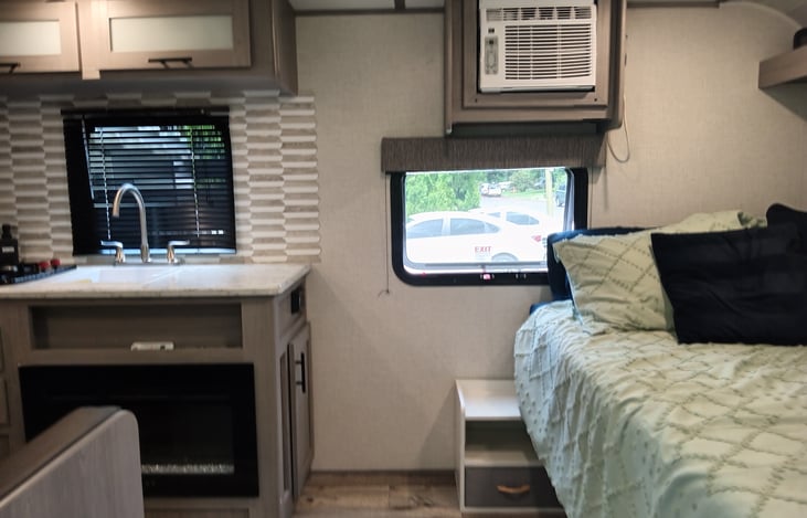 See that lovely little table right there, perfect for your night drink. Window opens too, perfect for that night breeze.