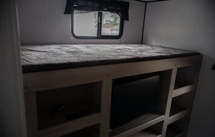 Top bunk in the back bedroom!