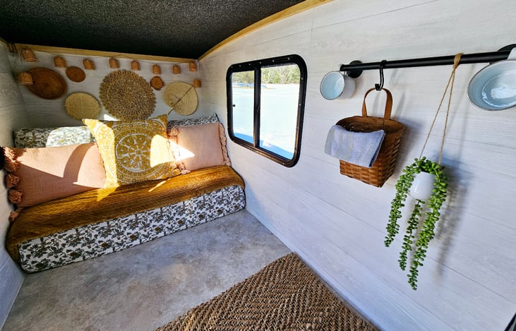 Interior Back End - Pull out couch that sleeps 2, locking windows with screens and curtains (curtains were installed after this photo was taken)