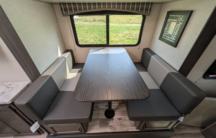 Smart layout featuring a chef’s rear galley and a slide-out dinette with a huge panoramic window. Enjoy great meals, natural light, and scenic views in a surprisingly spacious interior!