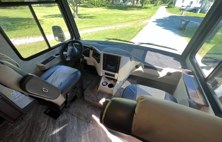 Captain's chairs with working station on passenger side.
