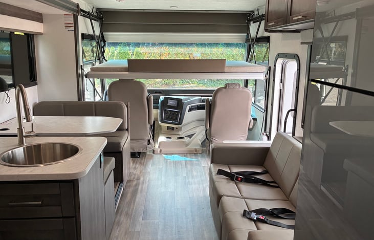 Drop down bed with safety rail or front area