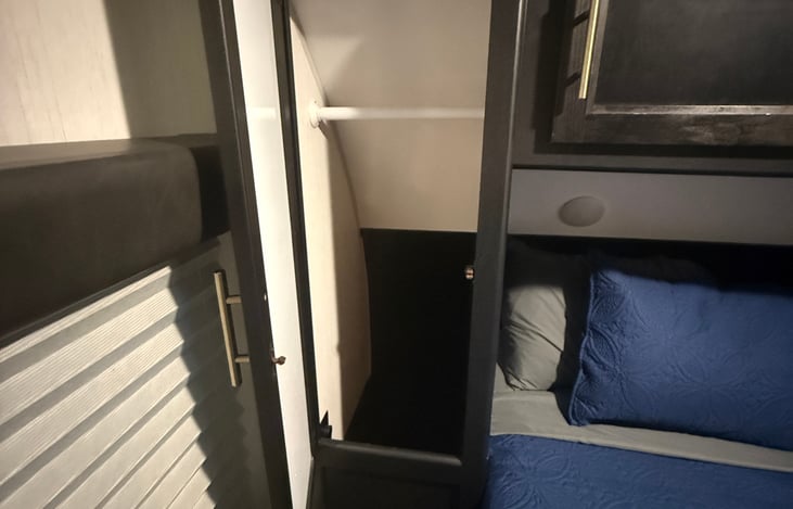 Hanging shelves on both sides of bed